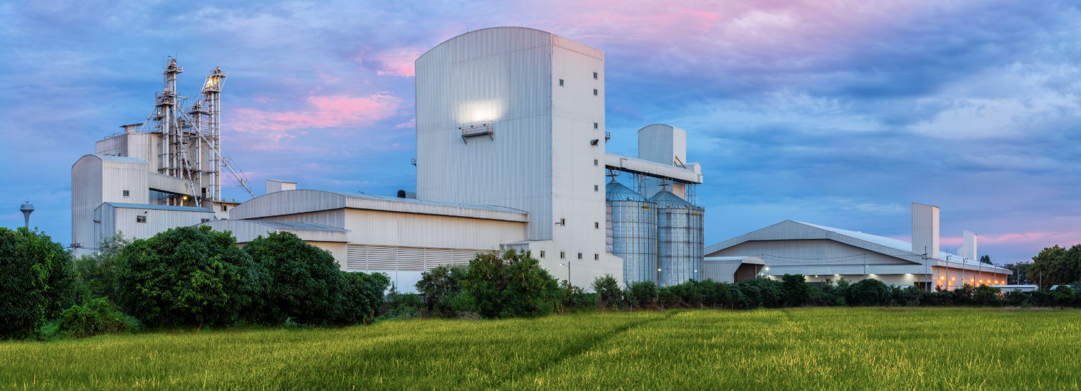 white builds and silos on a large farm